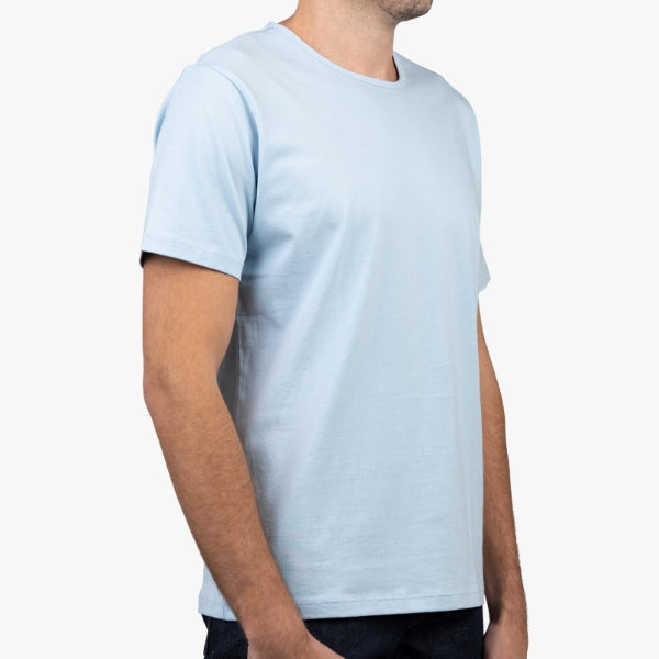 Light Blue T-Shirt on Model Facing Forward at an Anglea