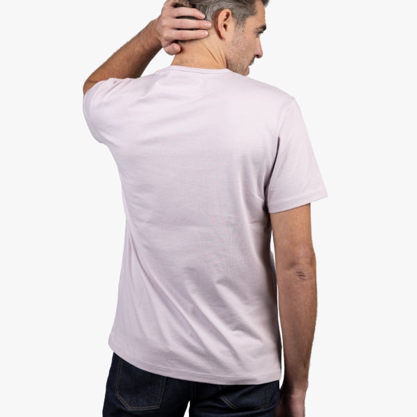 Light Purple T-Shirt on Model Facing Backward with Hand behind Head