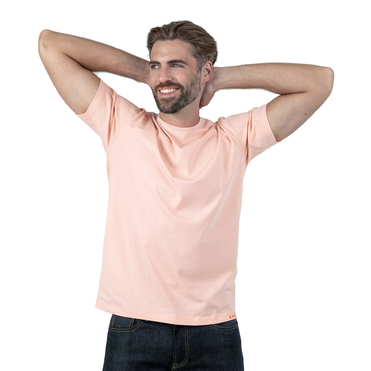 Light Red T-Shirt on Model Forward Facing with Arms Behind Head